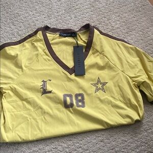 Lioness size, small yellow and brown V-neck jersey top NWT
